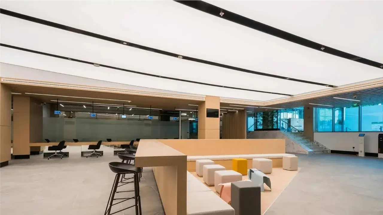 large acoustic stretch ceiling panels in modern bangkok lobby design